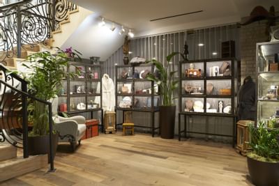 lounge area with book shelves and staircase