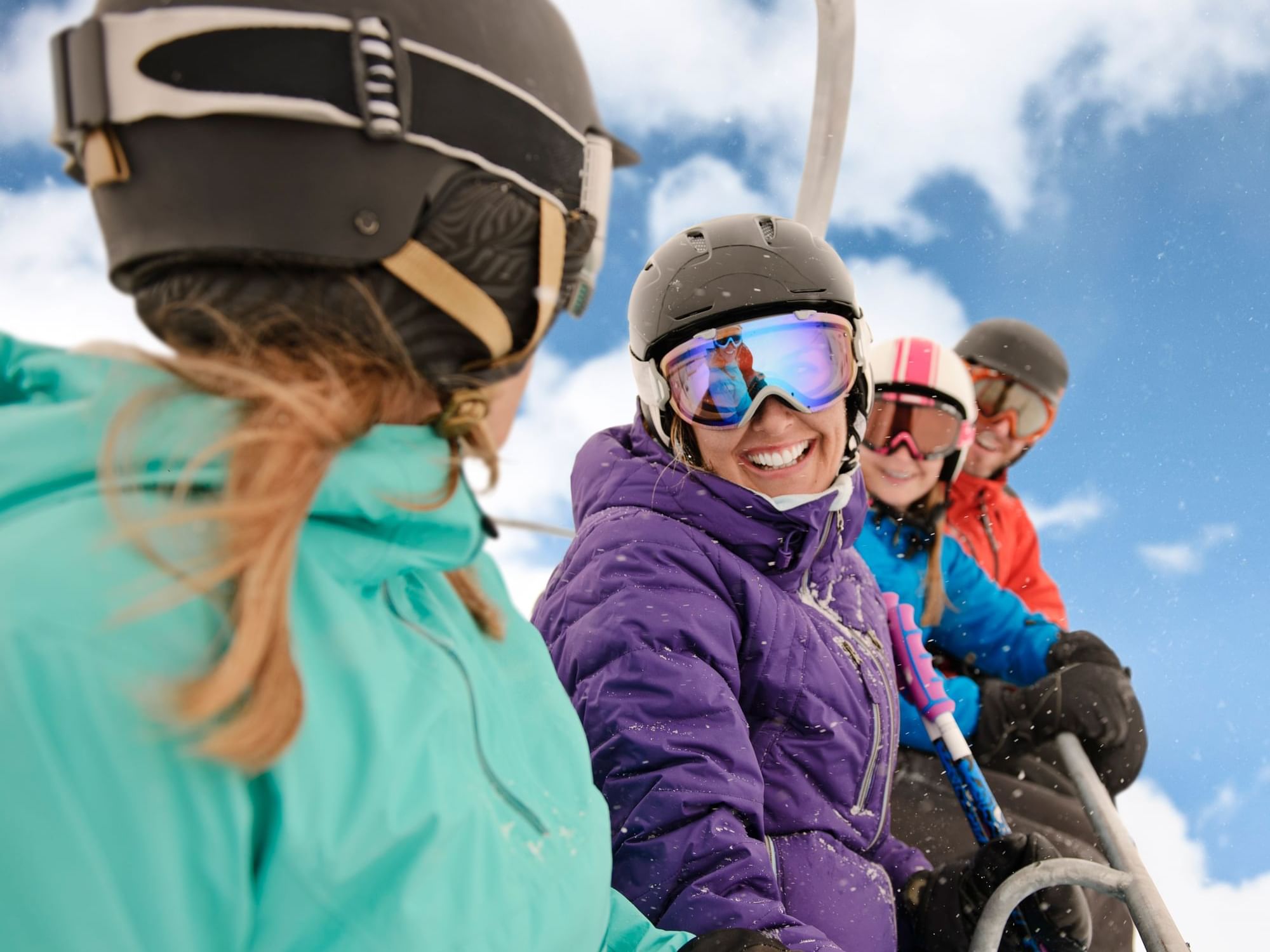 Closeup of skiers on a chairlift near Blackstone Mountain Lodge