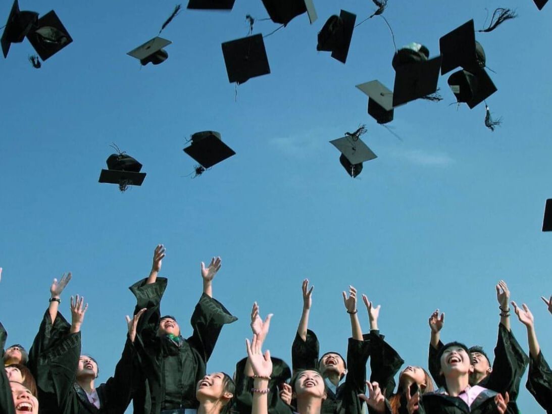 Students throwing Graduation hats on a Party outdoors at Park Hotel Hong Kong