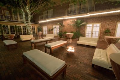 Seating in the courtyard at Horton Grand Hotel at night