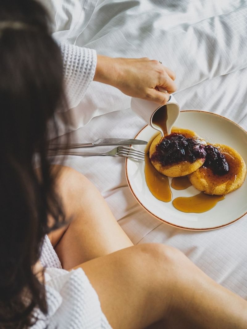 Closeup on a girl enjoying pancakes at May Fair Hotel London