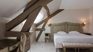 Interior of teriple room at Hotel Les Poemes de Chartres