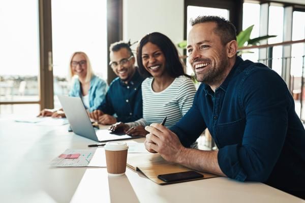 People laughing during meeting at good humour, a great way to keep people engaged