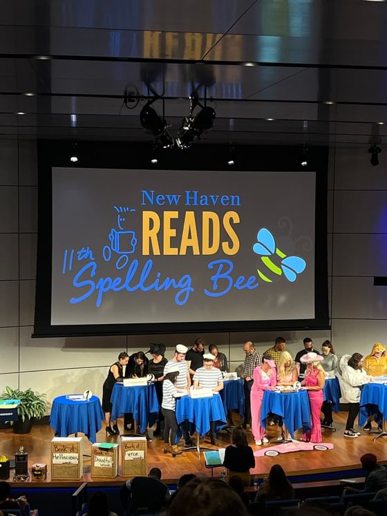 Spelling bee event at New Haven Reads, with participants at the stage at The Study at Yale