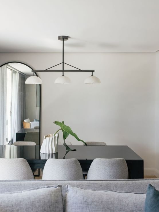 Coastal Two Bedroom Suite at Elysium Manly with a black table by a tall mirror, one of the best places to stay in Manly