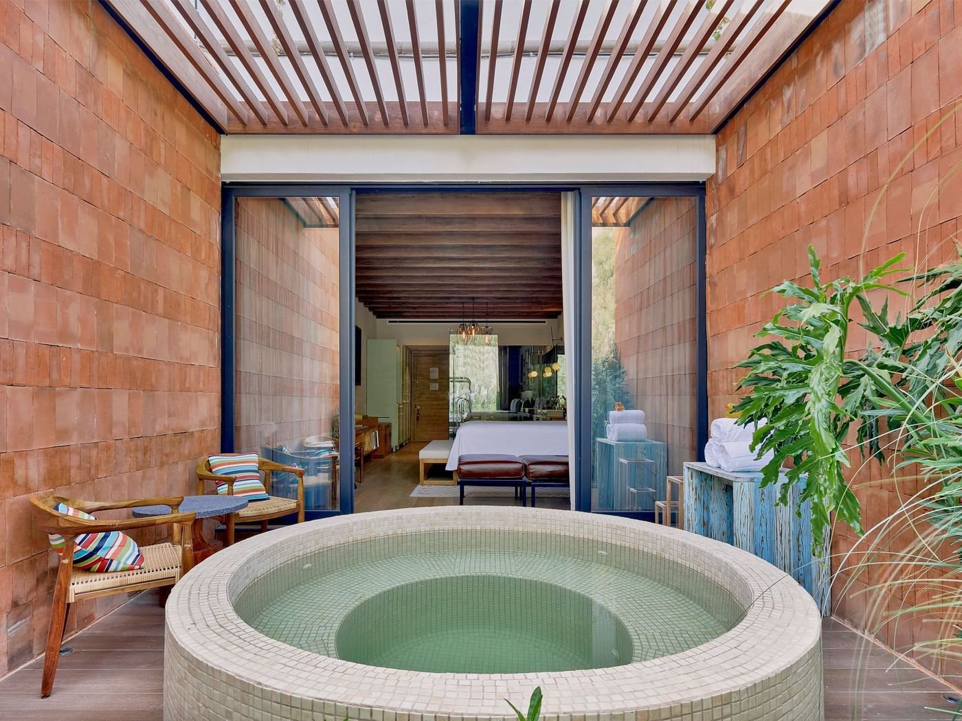 Seating arranged by the built-in bath tub in Wellness Suite at Live Aqua San Miguel de Allende