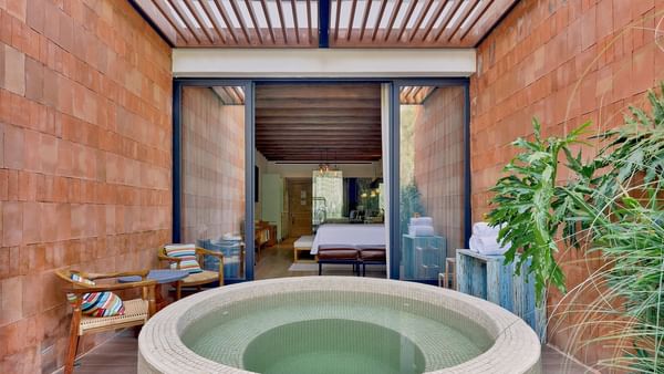 Seating arranged by the built-in bath tub in Wellness Suite at Live Aqua San Miguel de Allende