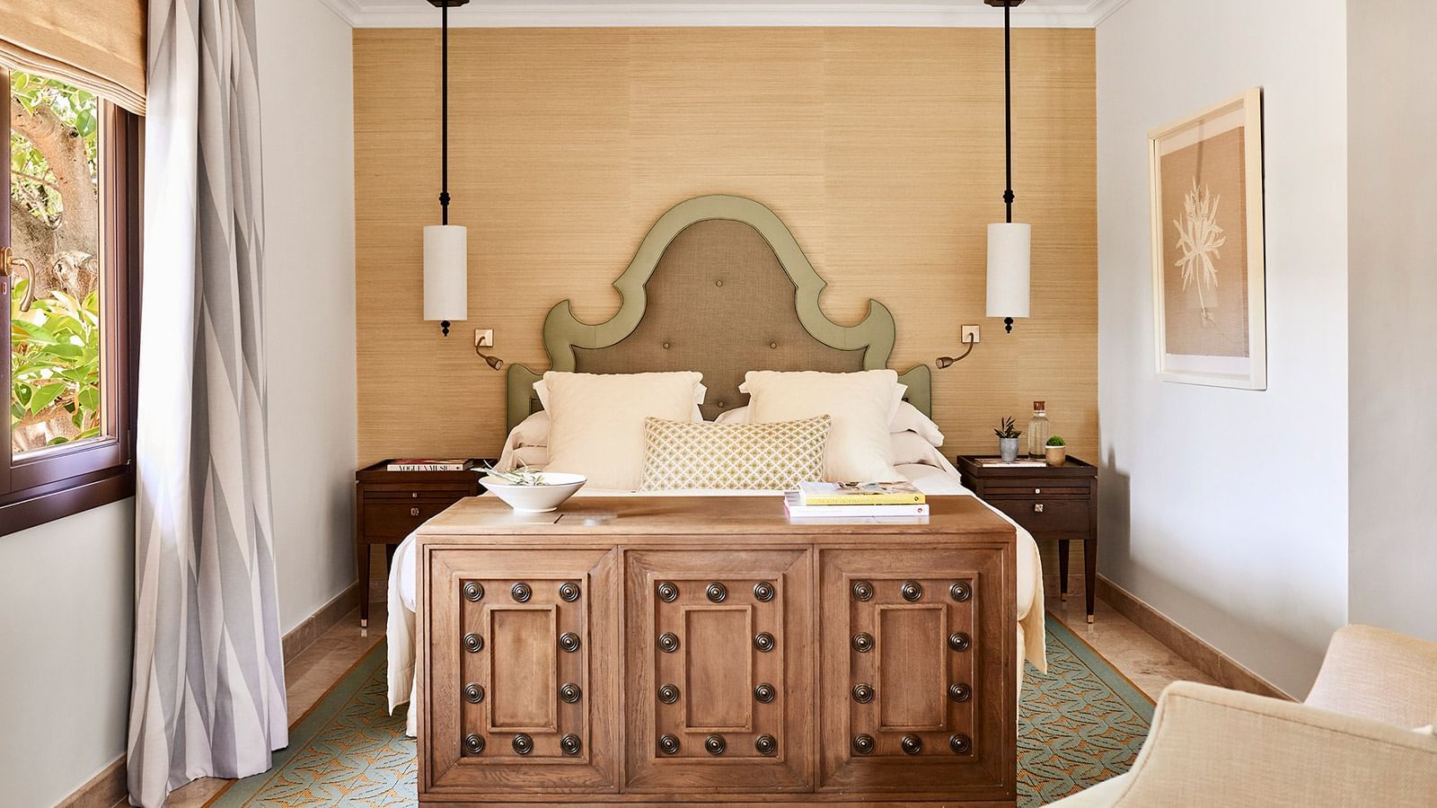 Conde Rudi with a cozy bed, ornate wood trunk, and soft lighting, luxury accommodation at Marbella Club