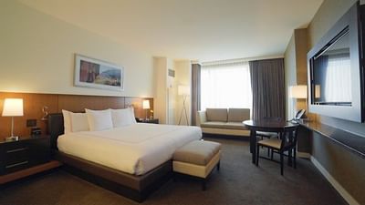 a comfy bed in a hotel room