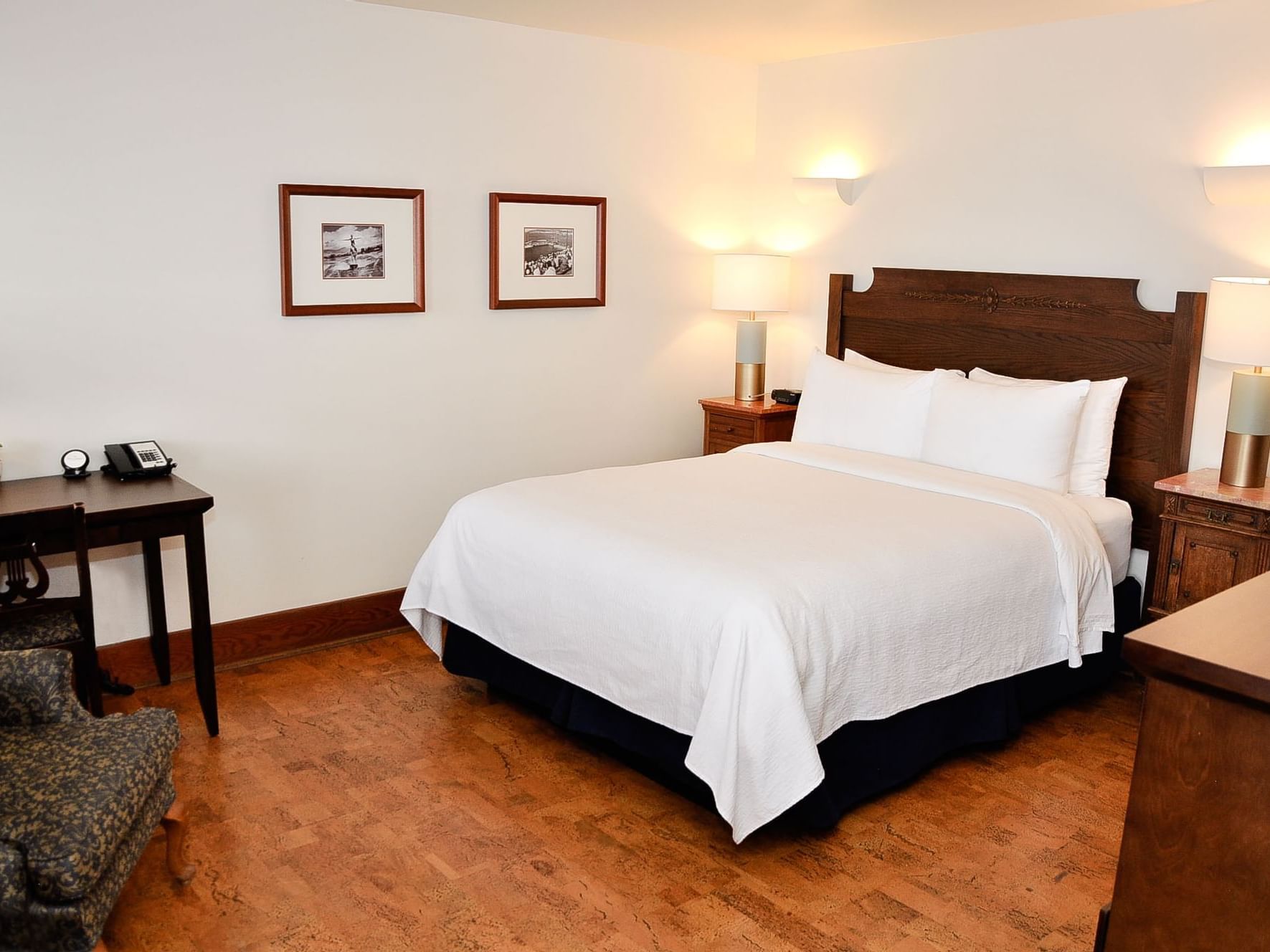 Queen bed in Heritage Lake View Queen Room at Hotel Eldorado