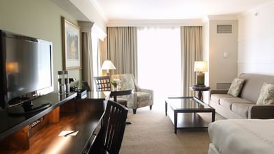 living room of hotel with television and couch
