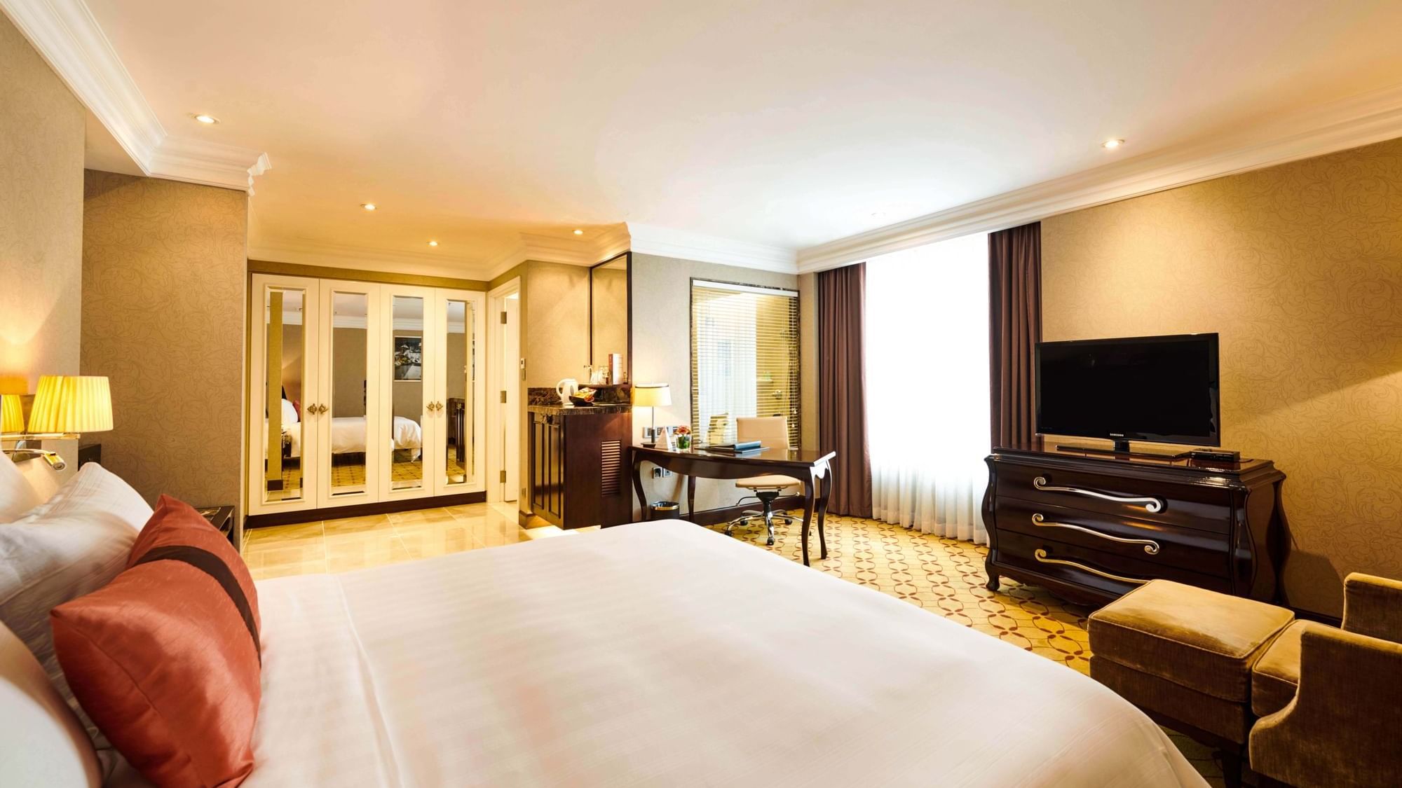 Bed & furniture in Premium Deluxe Room at Eastin Hotels