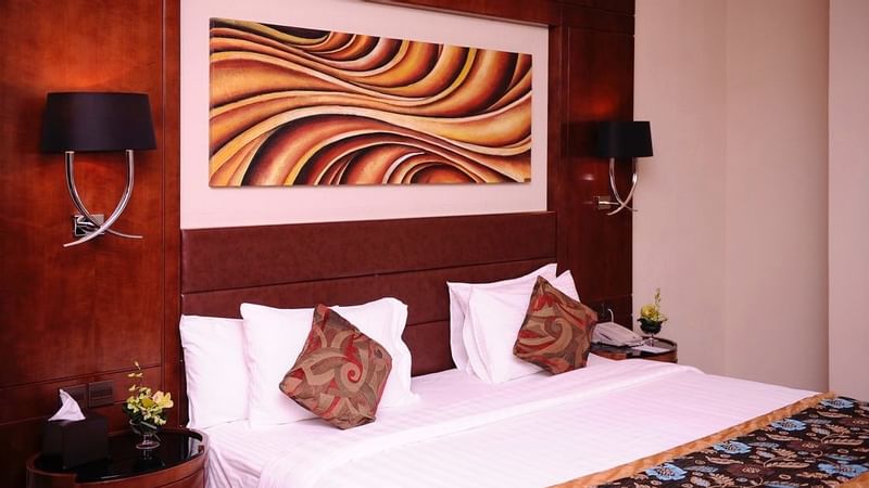 Bed with nightstands in Deluxe Room at Al Hamra Palace by Warwick Riyadhd