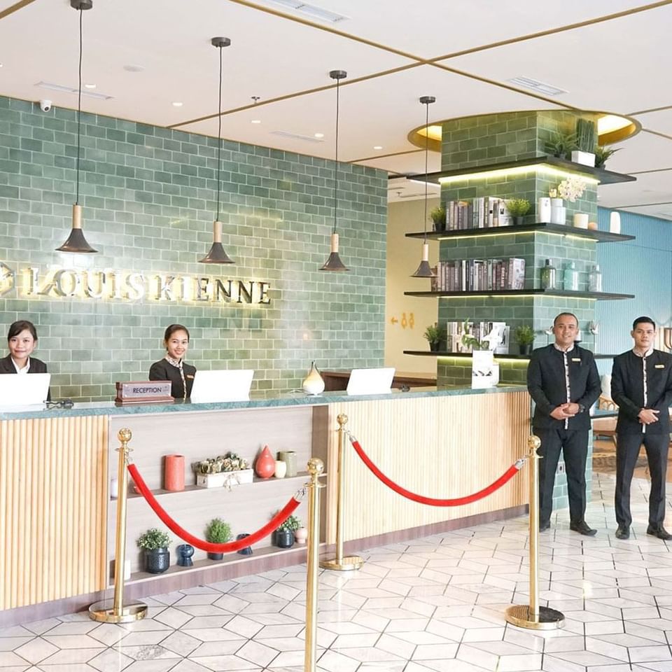 Receptionists near the front desk at LK Pemuda Semarang Hotel & Residences