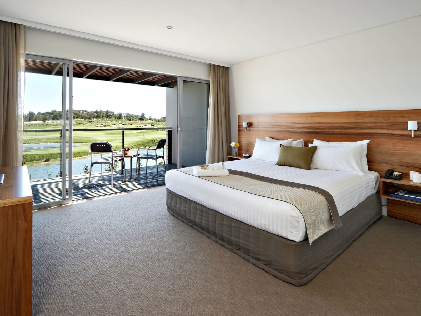 3 Bedroom Villa bedroom at Pullman Magenta Shores, offering a private balcony with stunning golf course views