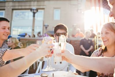 group of friends enjoying dinner on the waterfront