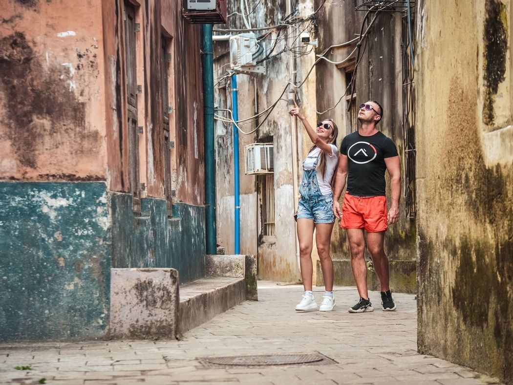 A couple exploring the city streets near Zanzibar Serena Hotel
