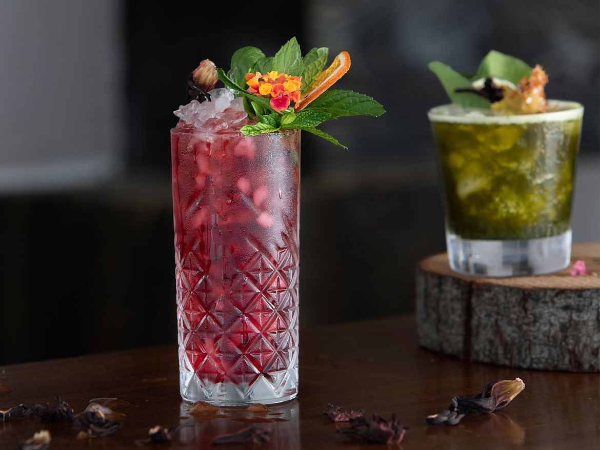 Closeup of 2 cocktail glasses on a table in Coco Bar at Senses