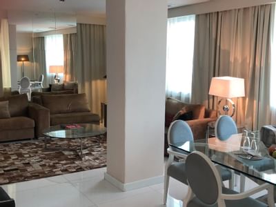 Dining table by lounge area in Presidential Suite at Hotel Presidente Luanda