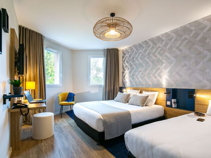 Beds & furniture in Triple Superior Room at Originals Hotels