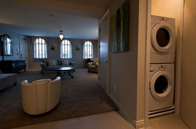 Living area & washer & dryer in Apartment 202 at Retro Suites Hotel