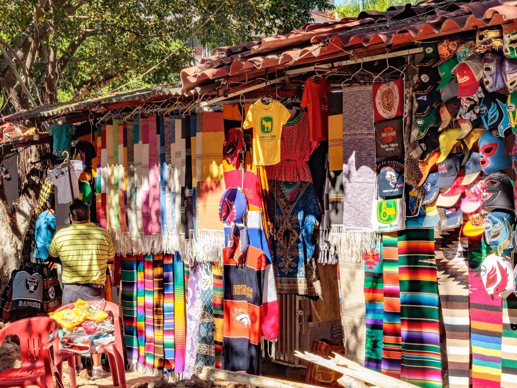 Flea Market with colorful items for sale near Plaza Pelicanos Grand Beach Resort