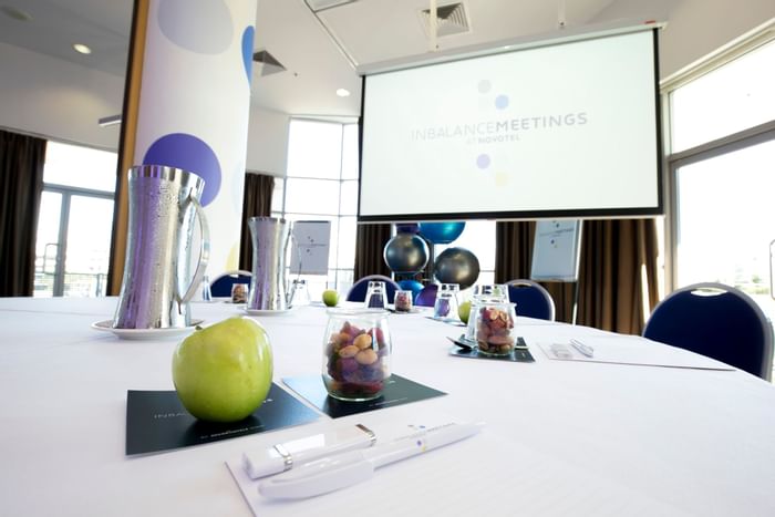 Wide Screen with table - Novotel Sydney Olympic Park