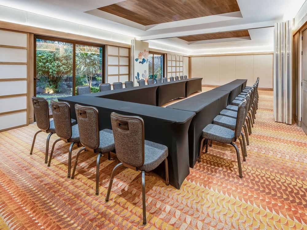 Stylish U-typed table setup with comfortable chairs in Salon 7-8 at Grand Fiesta Americana