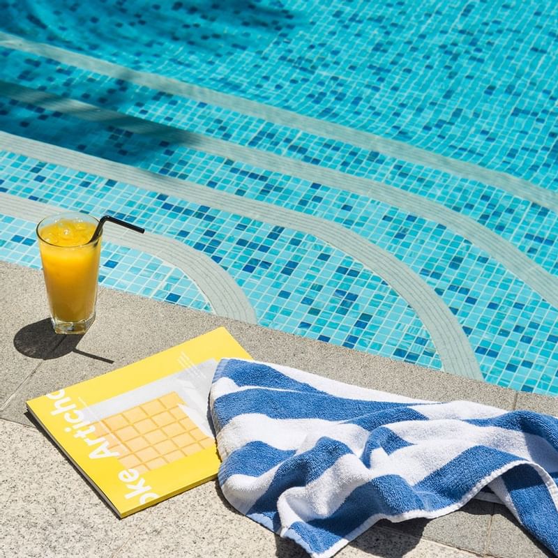 Fresh juice & towel near the pool at Crown Promenade Perth