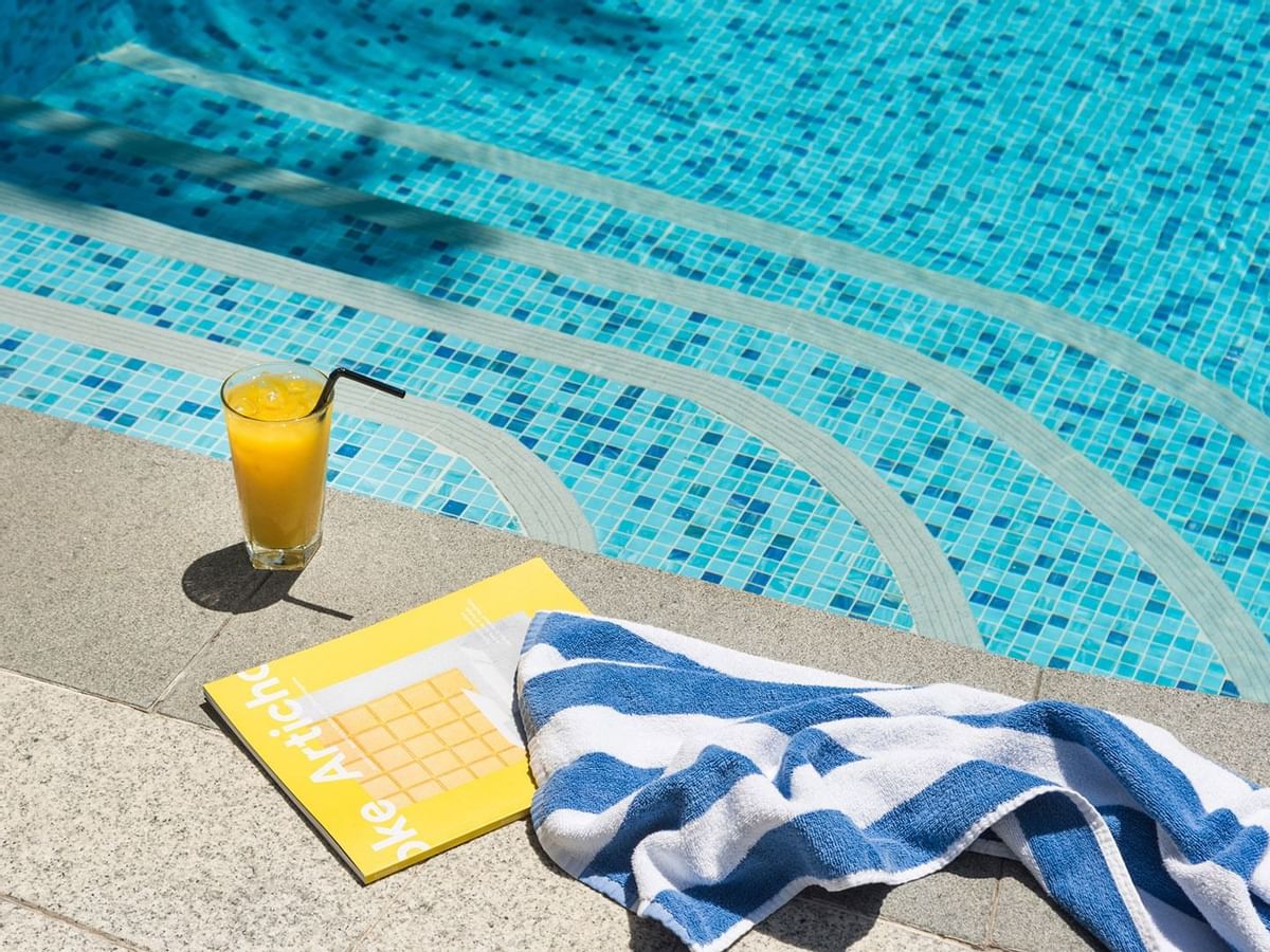 Fresh juice & towel near the pool at Crown Promenade Perth