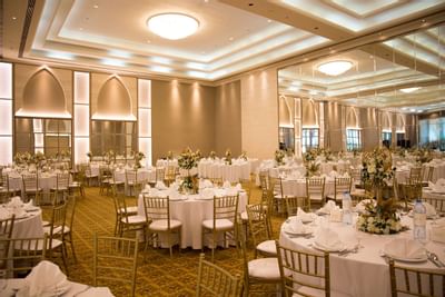 Banquet tables arranged in a Ballroom at Ajman Hotel