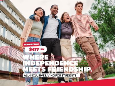 Four happy students jumping outside a building, advertising Mayoral Drive Student Accommodation.