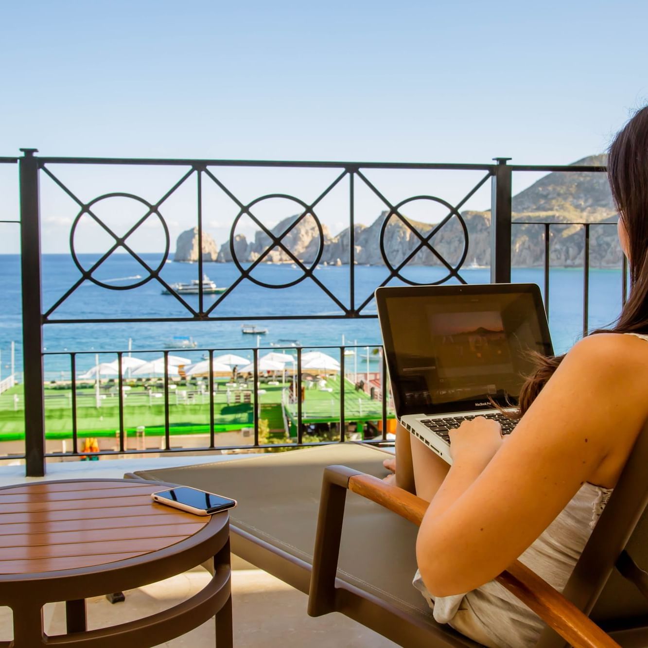 Portrait of Lady working in balcony at Casa Dorada Los Cabos