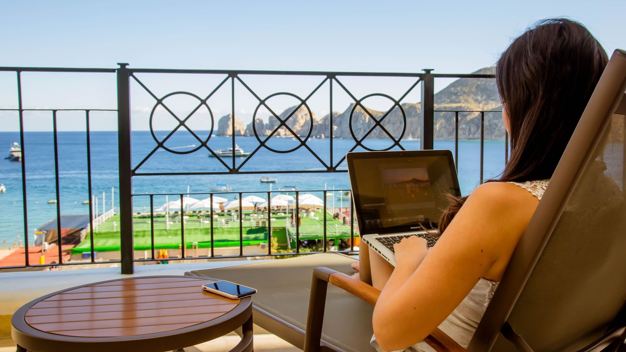 Portrait of Lady working in balcony at Casa Dorada Los Cabos