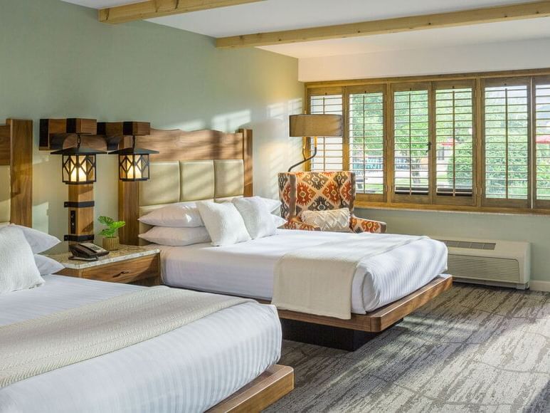 A Double Queen Bedroom with two cozy beds at High Peaks Resort
