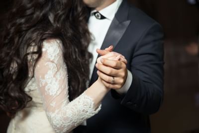 A couple holding hands for a photoshoot at Paradox Hotel