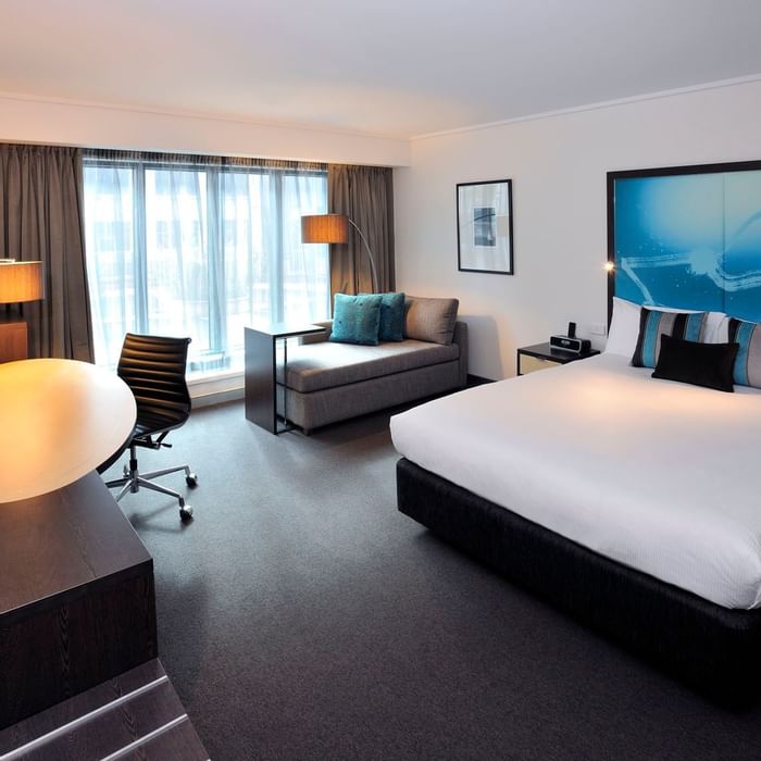 Junior Suite with king bed & sofa at Novotel Melbourne