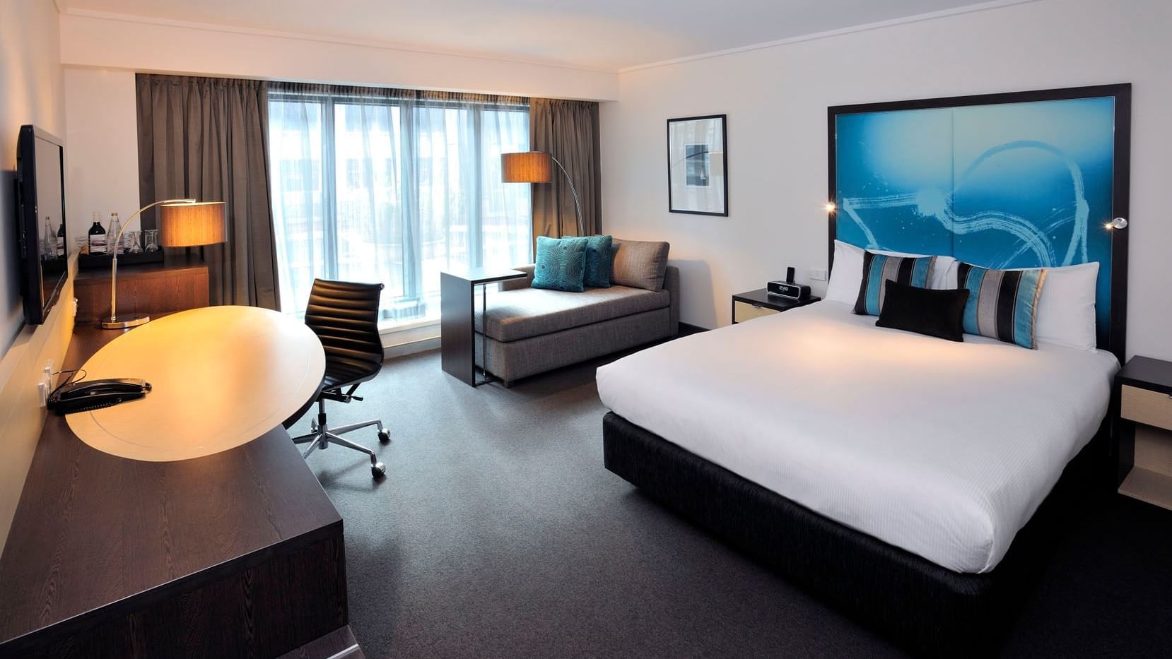 Junior Suite with king bed & sofa at Novotel Melbourne