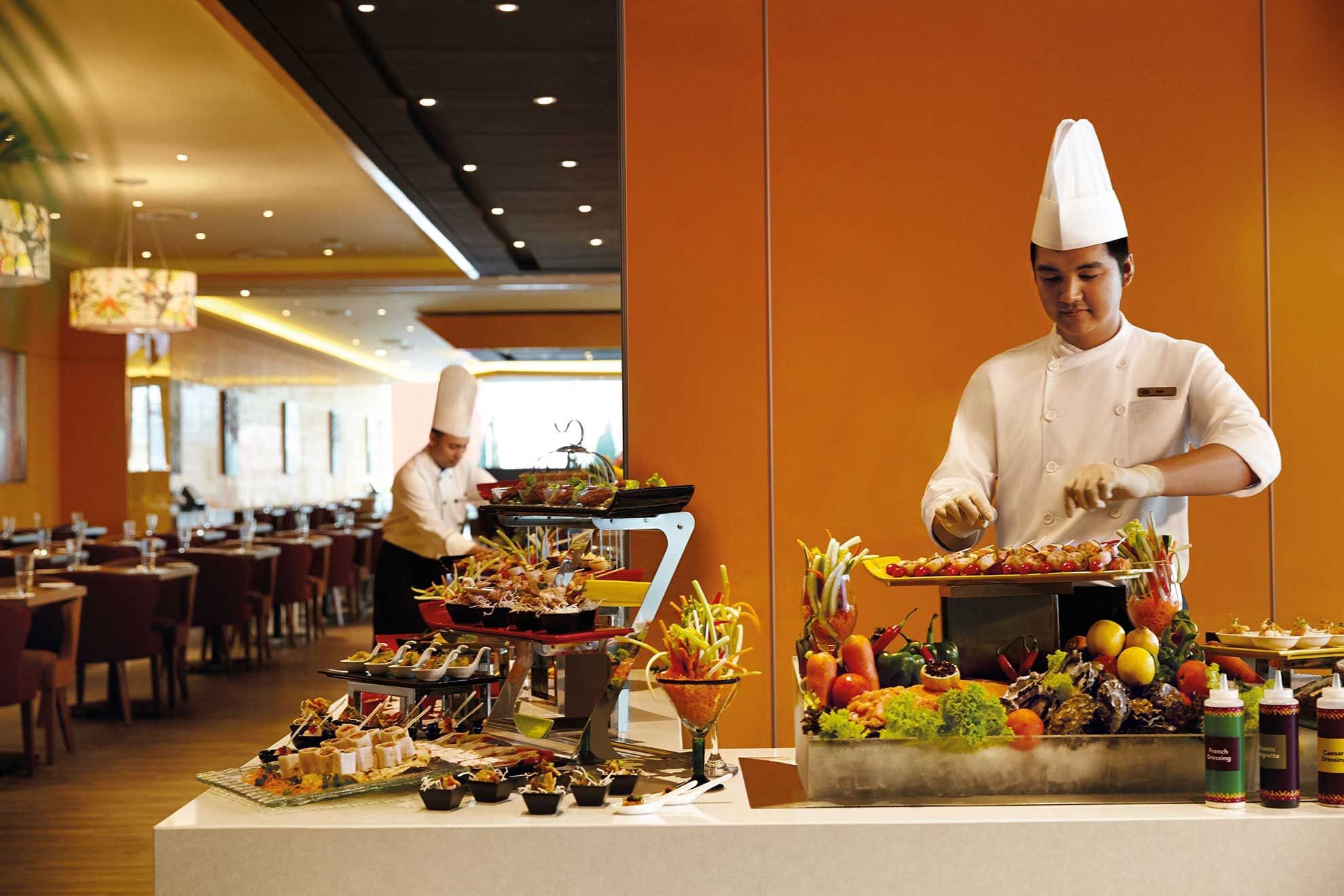 Chef garnishing a dish in Cafe West at Sunway Lagoon