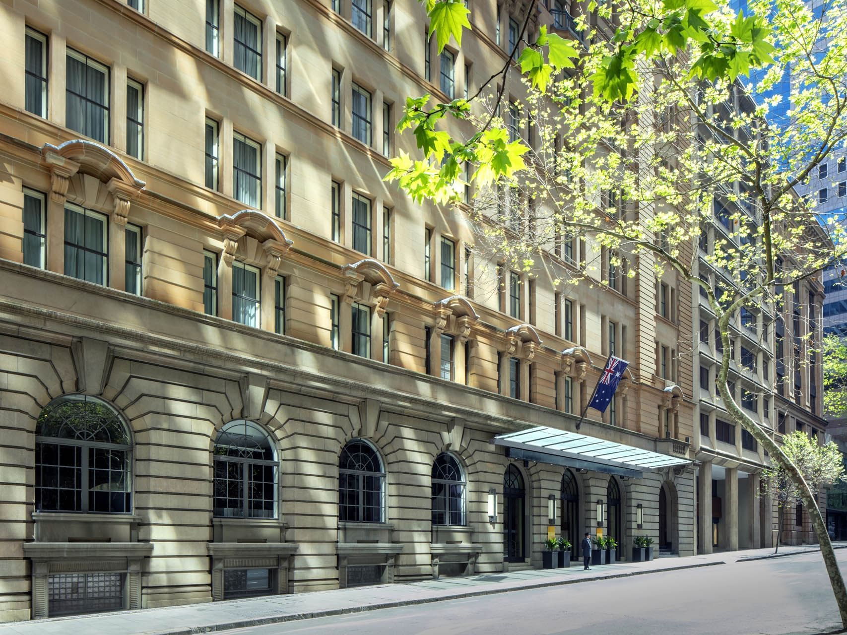 Elegant exterior of the Paradox Sydney hotel on a sunny day, showcasing its classic design, a 5-star hotel in Sydney
