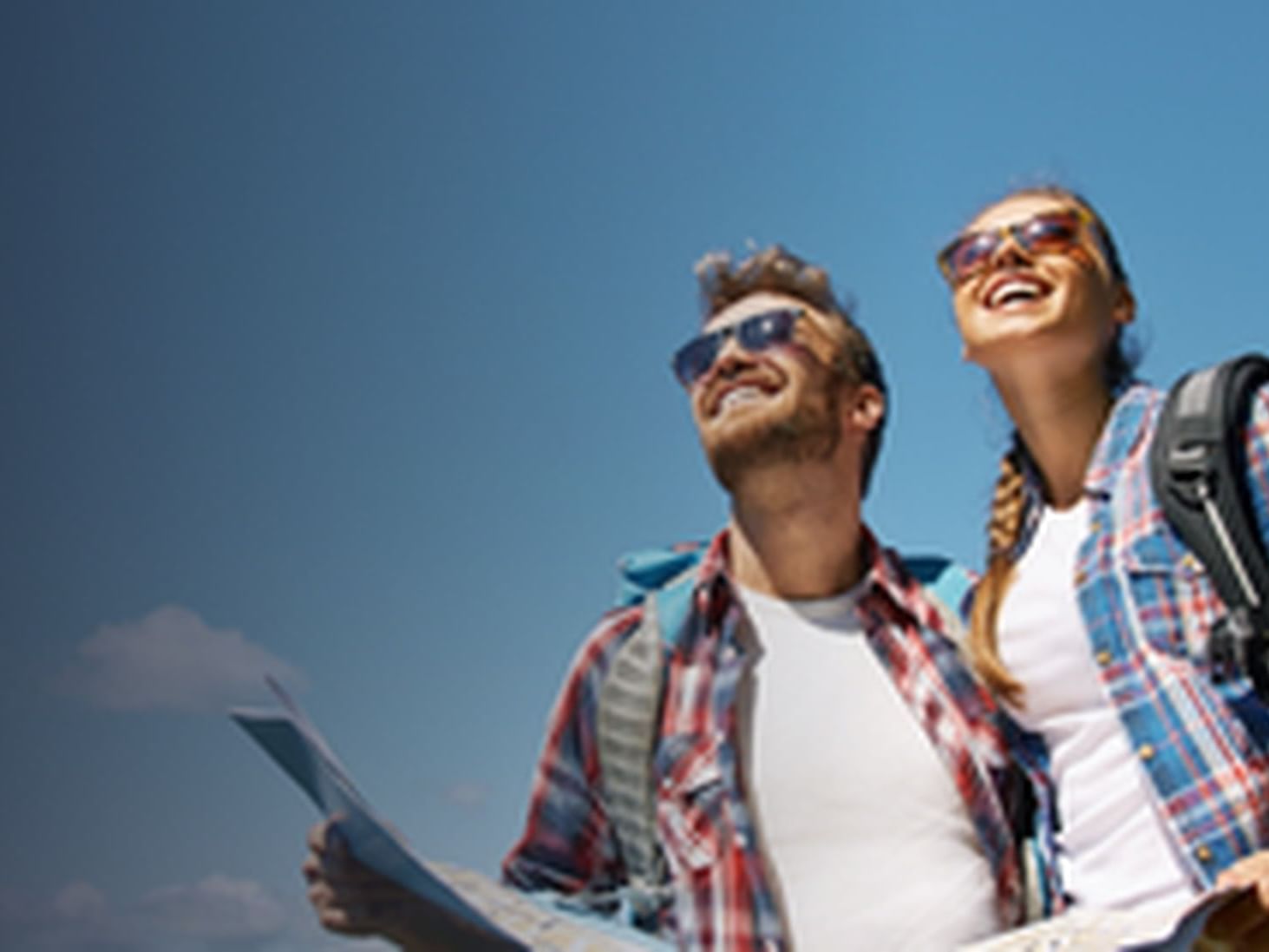 Two tourists with a map looking at the sky in The Wander Hotel