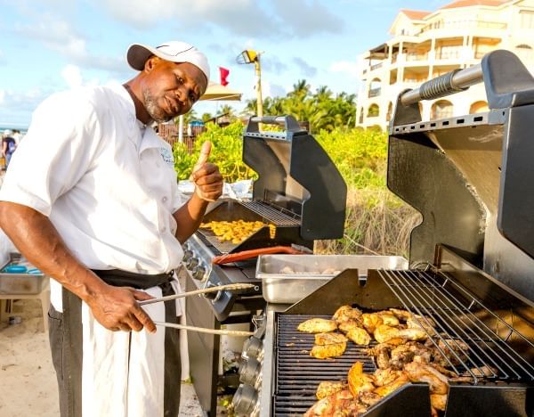 BBQ chef posing at The Somerset On Grace Bay