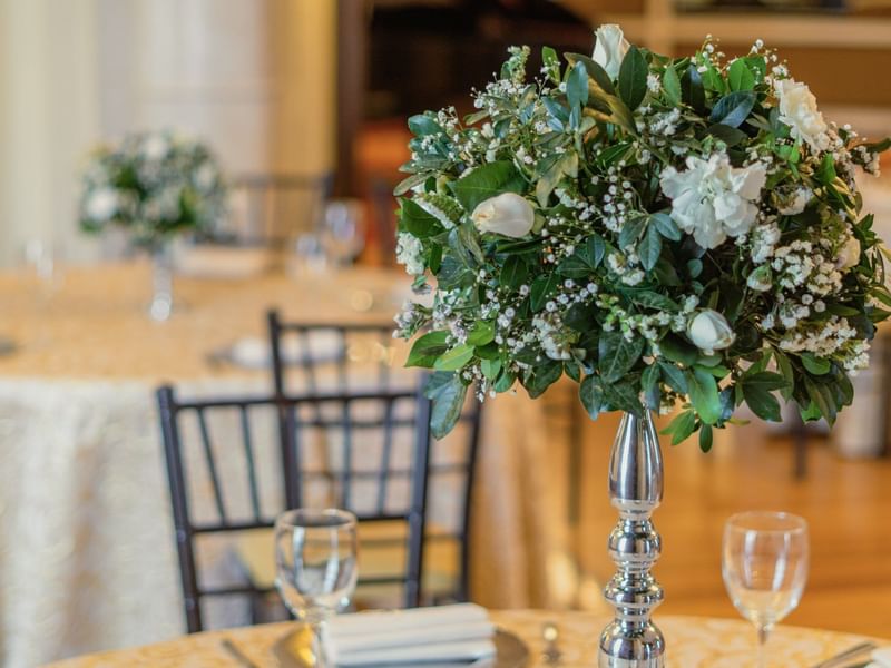 Close-up of a floral centerpiece in Luis XV at Gamma Hotels