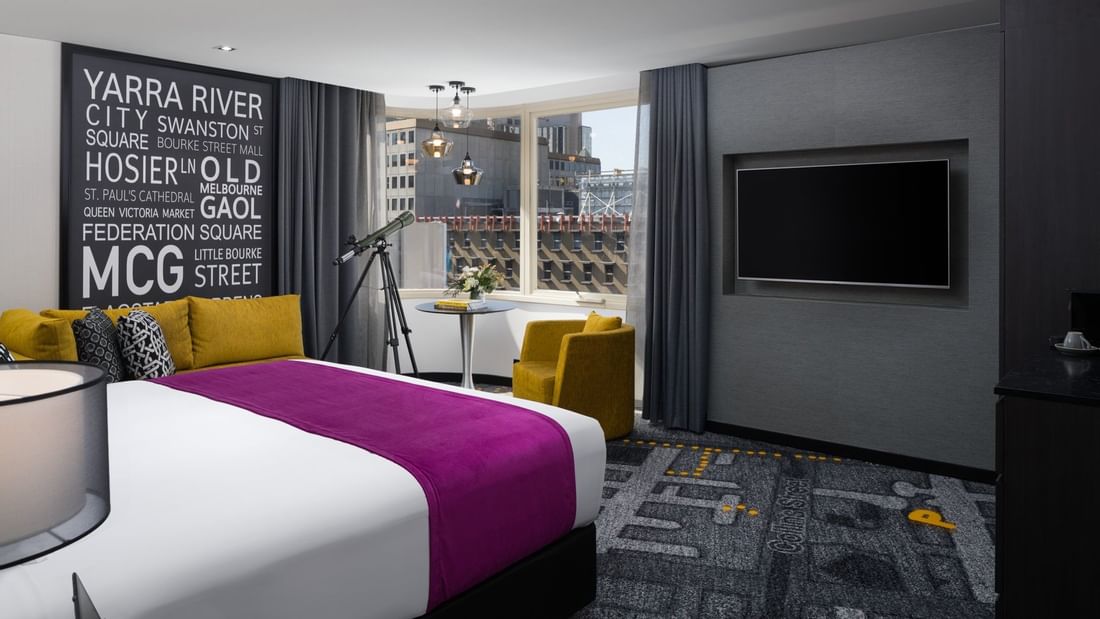 King-sized bed in Deluxe Room at Pullman Melbourne City Centre