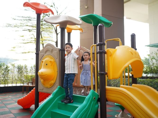Two kids playing in the Kids' Playground at Chatrium Hotels