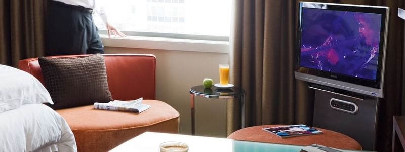 Acccommodation with a work desk and sofa at Pullman Sydney Olympic park