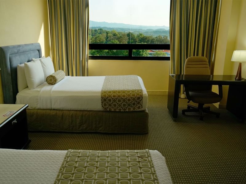 Bedroom with forest view in Junior Suite at Gamma Hotels