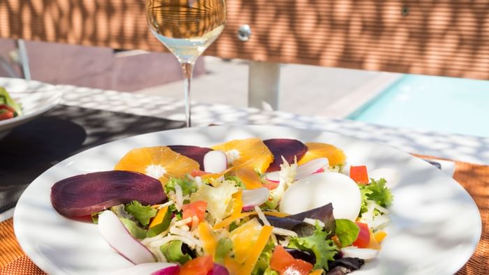 Closeup of a fancy salad plate served at Le mas  des grille
