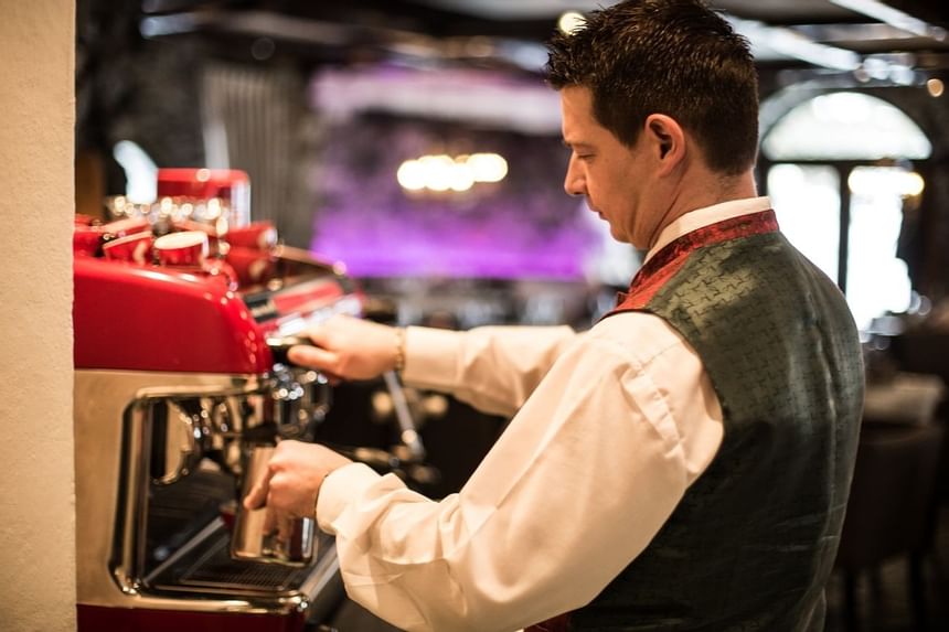 Bartender at a bar machine at Liebes Rot Flueh