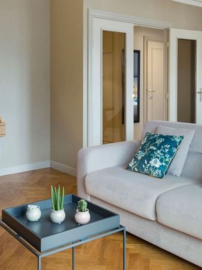 Work desk and dining table by the living area in Premium Suite with wooden floors at Warwick Reine Astrid - Lyon